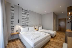 Postel nebo postele na pokoji v ubytování Hotel Kroi