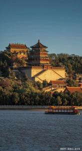 a large building on a hill next to the water at base-Beijing Wangfujing Serviced Apartment- in Hutong &Bike rental &Close to Forbidden City, Tian'anmen Square &Subway nearby &Free coffee &Washing machine,Kitchen &Restaurant discount &English speaking &High speed free WiFi in Beijing