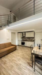 a large living room with a couch and a table at Casina Miriano in Castiglione del Lago +20 photos