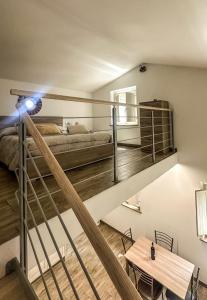 a bedroom with a bunk bed and a table at Casina Miriano in Castiglione del Lago