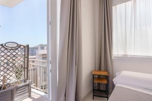 Postel nebo postele na pokoji v ubytování Lumiere Rooms - Eja Sardinia