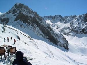 a group of people skiing on a snow covered mountain at Résidence Marmottes - Studio cabine avec place de parking couvert privé MAE-8274 in Barèges +2 photos