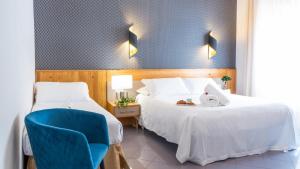 Postel nebo postele na pokoji v ubytování Hotel Diana