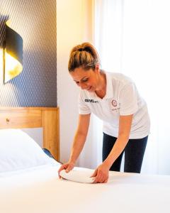 Postel nebo postele na pokoji v ubytování Hotel Diana