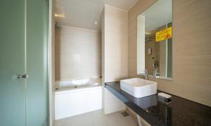 a bathroom with a sink and a bath tub at Wolmido Premiers Hotel in Incheon +13 photos