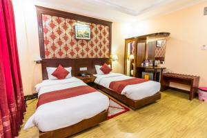 Cama o camas de una habitación en Hotel Pokhara Goodwill
