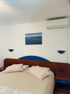 Postel nebo postele na pokoji v ubytování FUNTANA-MIA ROOMS B&B