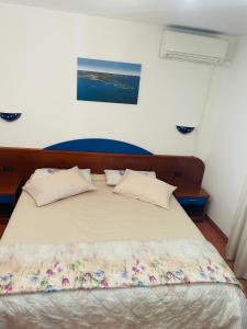 Postel nebo postele na pokoji v ubytování FUNTANA-MIA ROOMS B&B