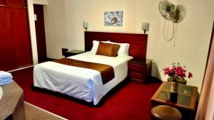 Cama ou camas em um quarto em Hotel Ferrua