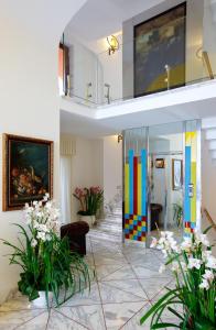 a lobby with a colorful door and flowers at Antico Casale Russo in Piano di Sorrento