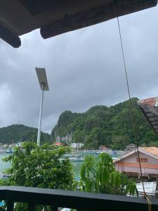 a view of a body of water with a mountain at Liam's Homestay El Nido in El Nido +18 photos