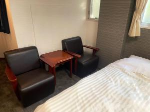 Voodi või voodid majutusasutuse Itoen Hotel Inatori toas