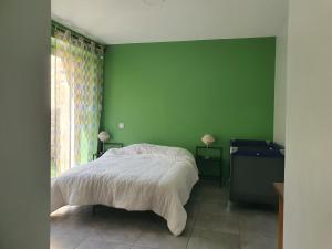 Postel nebo postele na pokoji v ubytování L'acacia