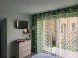 Postel nebo postele na pokoji v ubytování L'acacia