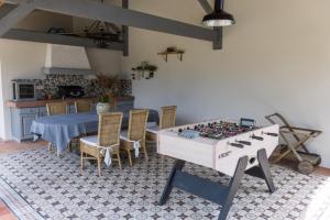 a living room with a table and a chessboard at Les rives de l'escamat in Sabres