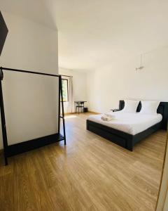 Postel nebo postele na pokoji v ubytování Canaan Hôtel Antsirabe