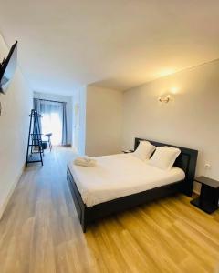 Postel nebo postele na pokoji v ubytování Canaan Hôtel Antsirabe