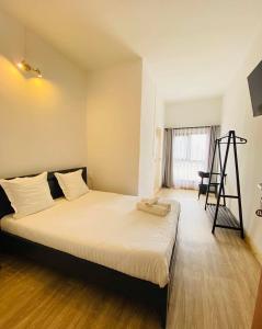 Postel nebo postele na pokoji v ubytování Canaan Hôtel Antsirabe