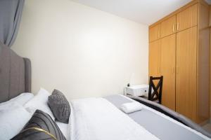Ένα ή περισσότερα κρεβάτια σε δωμάτιο στο South B Nest Suites