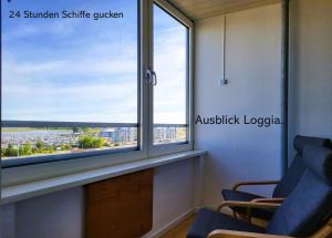 a window in a office with a view of a city at Leuchtfeuer in Wendtorf