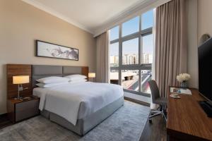 Letto o letti in una camera di Marriott Executive Apartments Doha, Le Mirage City Walk