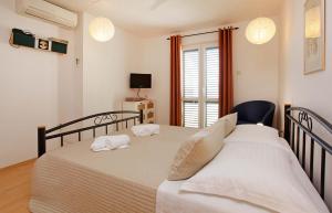 Posteľ alebo postele v izbe v ubytovaní Apartments Mel