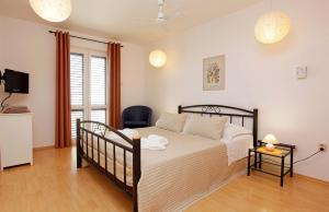 Posteľ alebo postele v izbe v ubytovaní Apartments Mel