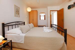 Posteľ alebo postele v izbe v ubytovaní Apartments Mel