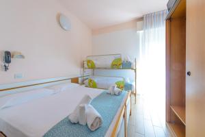 Postel nebo postele na pokoji v ubytování Hotel Colorado