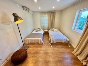 Ένα ή περισσότερα κρεβάτια σε δωμάτιο στο Retiro São Pedro House +24 φωτογραφίες