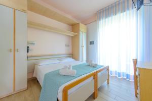 Postel nebo postele na pokoji v ubytování Hotel Colorado