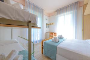 Postel nebo postele na pokoji v ubytování Hotel Colorado + 37 fotografií