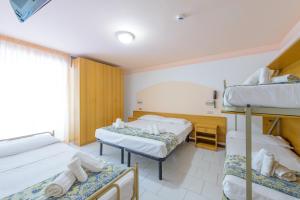 Postel nebo postele na pokoji v ubytování Hotel Colorado