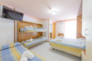 Postel nebo postele na pokoji v ubytování Hotel Colorado