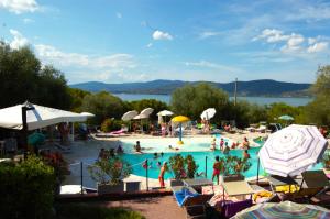 a group of people in a swimming pool at Cerquestra Camping Village in Monte del Lago