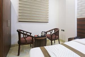 Postel nebo postele na pokoji v ubytování Hotel ECG Grand Inn-Near Delhi Airport