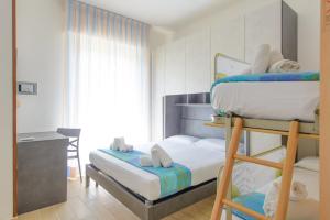 Postel nebo postele na pokoji v ubytování Hotel Colorado