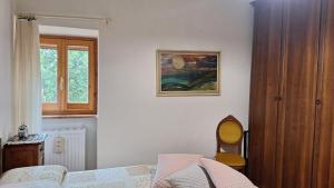 Postel nebo postele na pokoji v ubytování Casa Ausonia