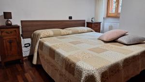 Postel nebo postele na pokoji v ubytování Casa Ausonia