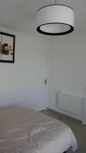 Postel nebo postele na pokoji v ubytování Ma chambre d'amis + 4 fotografie