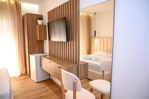TV a/nebo společenská místnost v ubytování Hotel Vila AARON