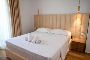 Postel nebo postele na pokoji v ubytování Hotel Vila AARON
