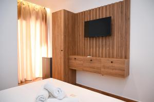 Postel nebo postele na pokoji v ubytování Hotel Vila AARON