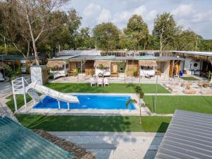 an aerial view of a house with a swimming pool at Beach House Pool Villa in Na Jomtien