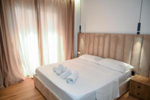 Postel nebo postele na pokoji v ubytování Hotel Vila AARON