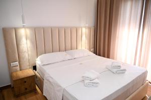 Postel nebo postele na pokoji v ubytování Hotel Vila AARON