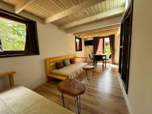 a living room with a couch and a table at Stanetestruzhes in Prizren