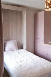 Posteľ alebo postele v izbe v ubytovaní Studio cocooning style naturel