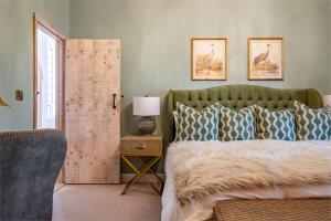 Ένα ή περισσότερα κρεβάτια σε δωμάτιο στο Gatehouse East