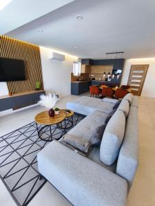 a living room with a couch and a table at Villa Milamar in Banjol